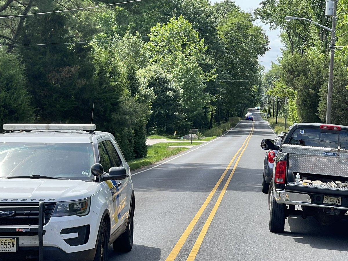 One person was killed and another was injured after part of a tree fell onto a moving car in Burlington County