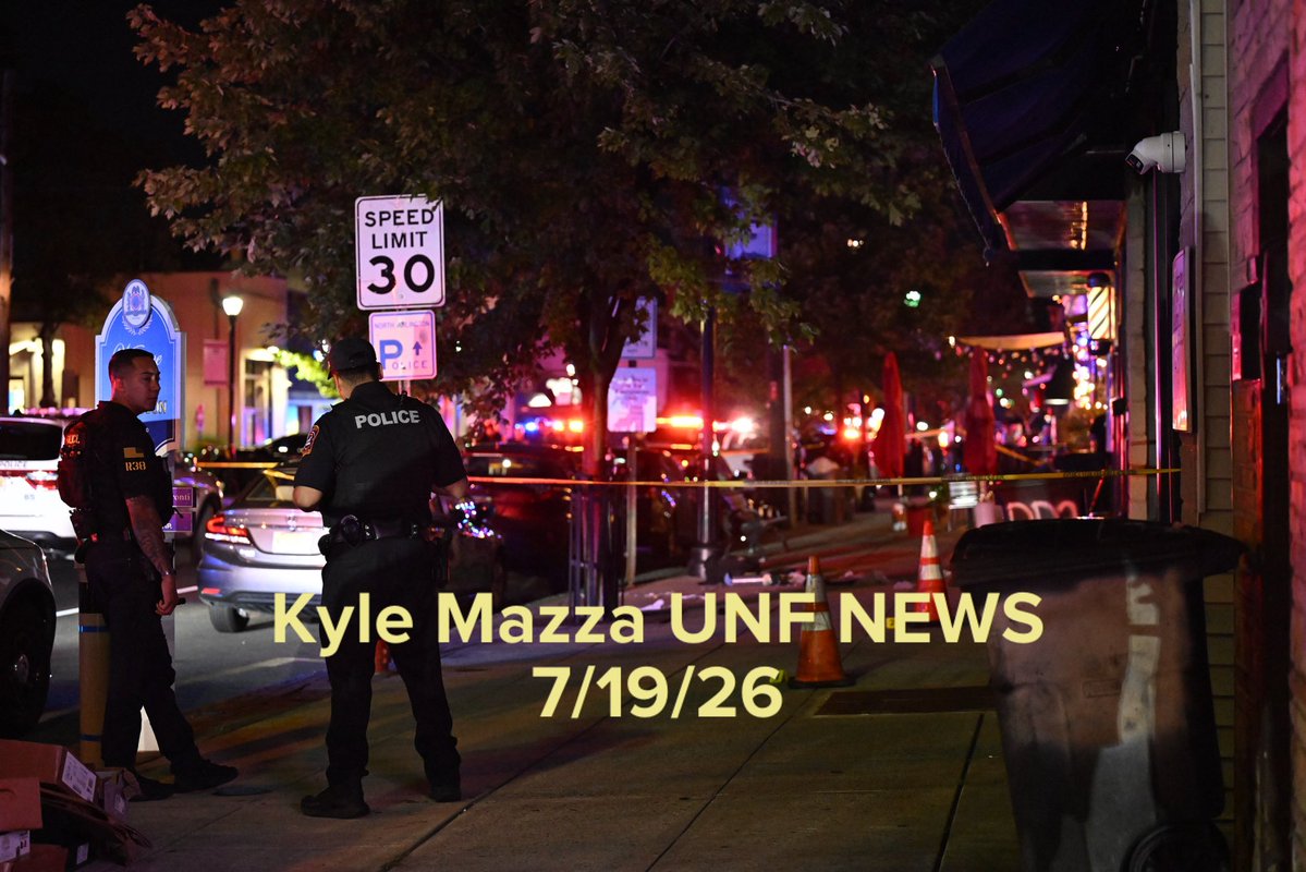 Authorities work the scene where multiple people were reported shot at a bar and lounge on Ridge Road in North Arlington, New Jersey, United States on July 19, 2026. Multiple people were reportedly injured and police officers including some in tactical gear were seen at the scene. Evidence markers were placed on the ground highlighting evidence discovered at the scene. No arrests have been made and the investigation is ongoing. 