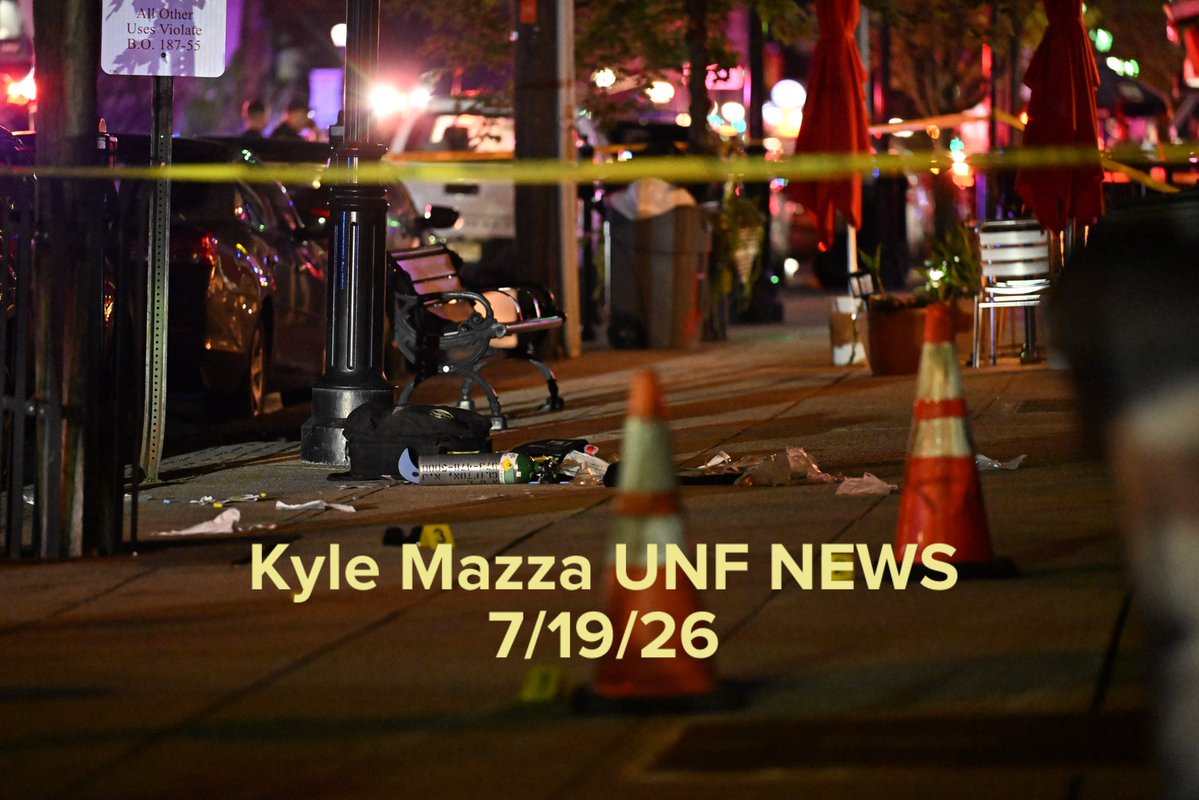 Authorities work the scene where multiple people were reported shot at a bar and lounge on Ridge Road in North Arlington, New Jersey, United States on July 19, 2026. Multiple people were reportedly injured and police officers including some in tactical gear were seen at the scene. Evidence markers were placed on the ground highlighting evidence discovered at the scene. No arrests have been made and the investigation is ongoing. 