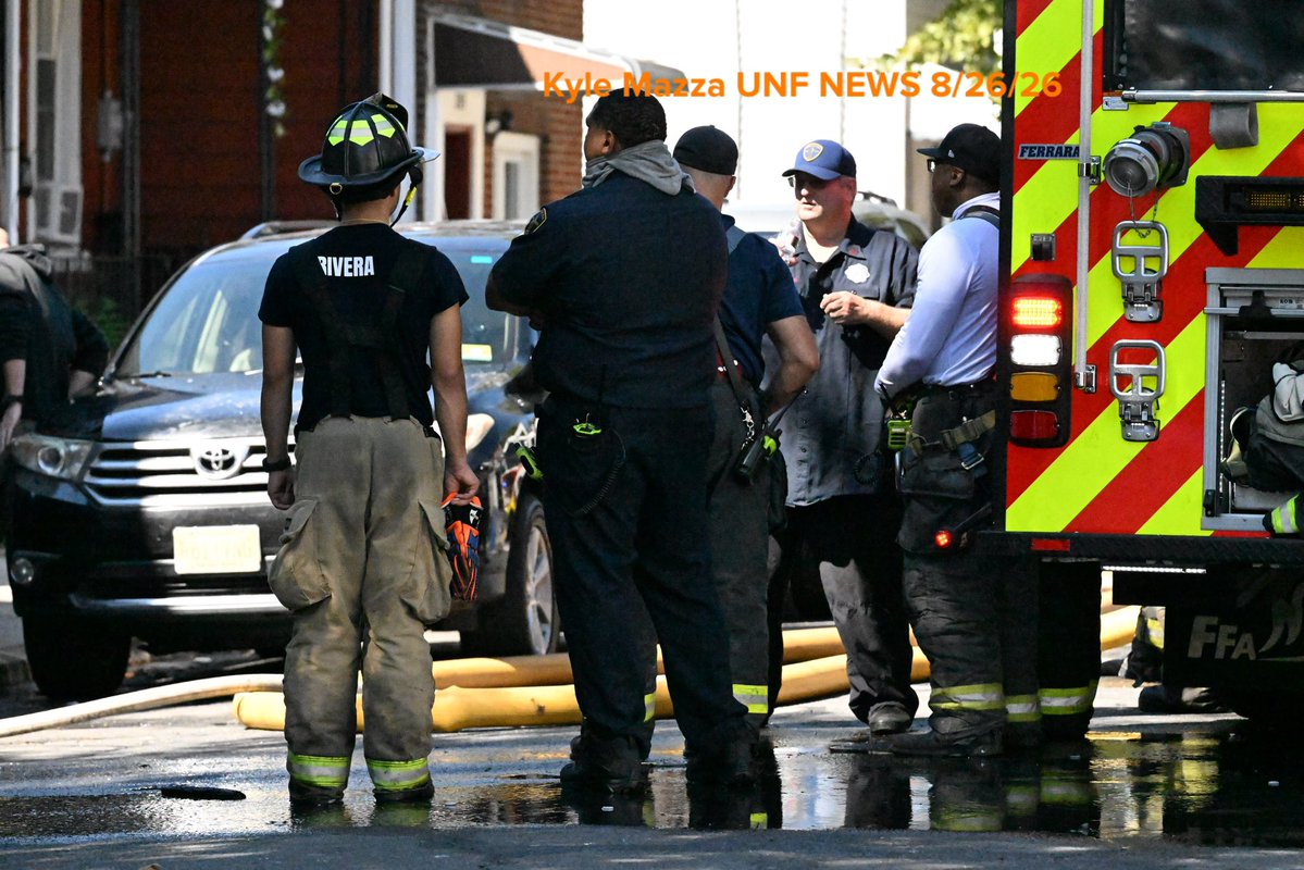 Trenton Fire Department personnel and investigators work the scene where two children died after a three-alarm house fire on the 300 block of Hewitt Street in Trenton, New Jersey