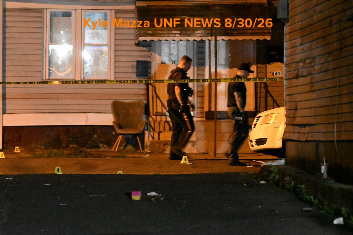 Evidence markers are seen on the ground where 2 people were killed and 9 people were injured in a mass shooting on Locust Street in Trenton, New Jersey, United States on Sunday 
